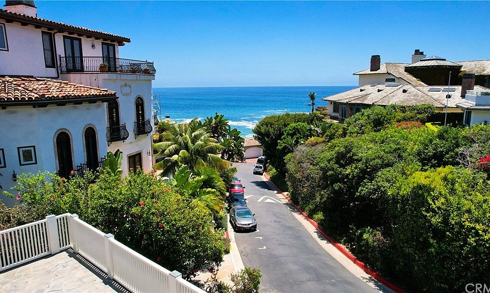 Looking down a quiet community street toward the open ocean